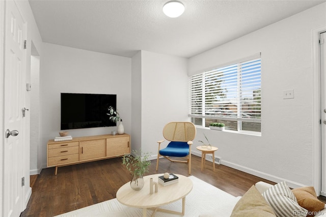 1414 W Nevada Pl, Denver, CO 80223 - living room featuring wood finished floors, baseboards, and a textured ceiling