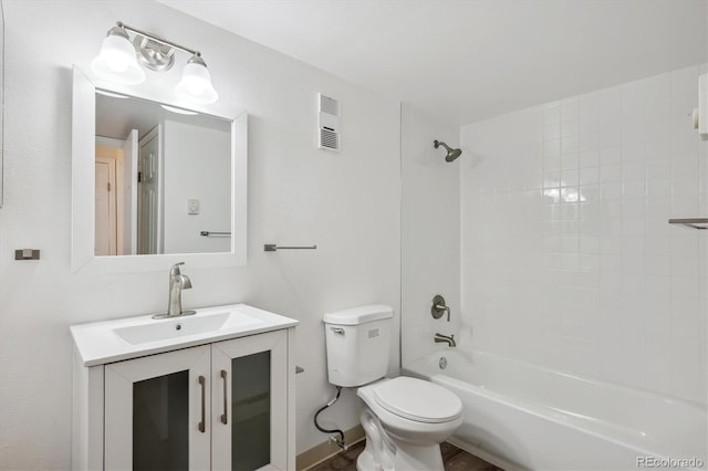 bathroom featuring toilet, vanity, and washtub / shower combination
