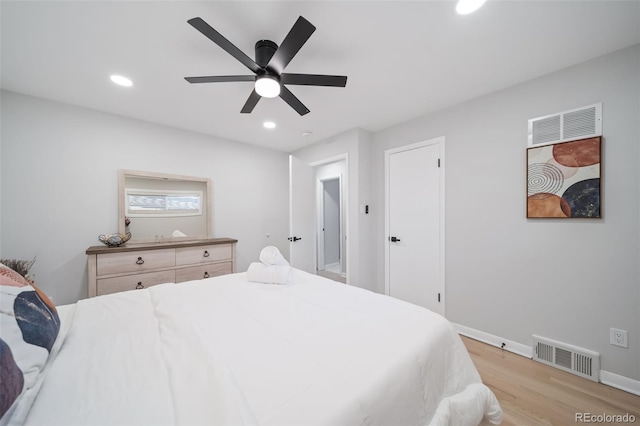 bedroom featuring light wood-type flooring and ceiling fan