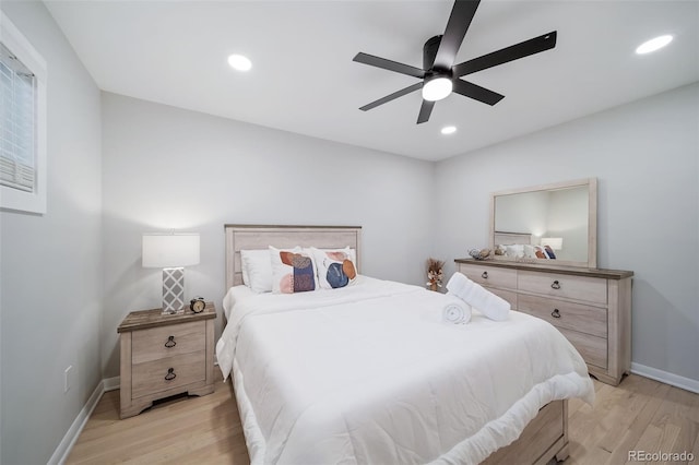 bedroom featuring ceiling fan and light hardwood / wood-style floors