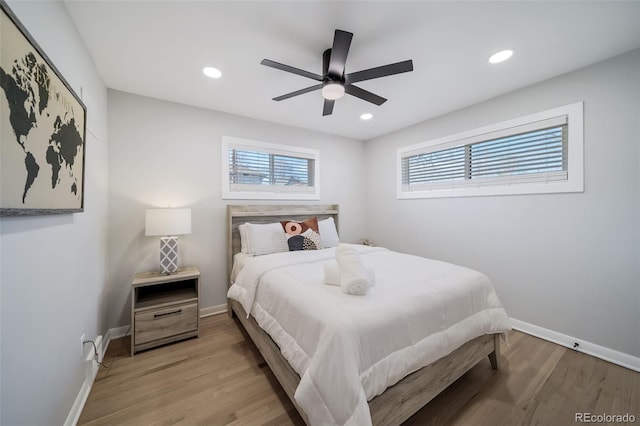 bedroom featuring light hardwood / wood-style floors and ceiling fan