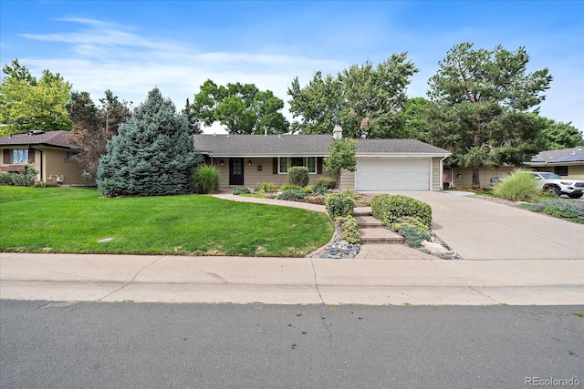 ranch-style house featuring a front yard and a garage