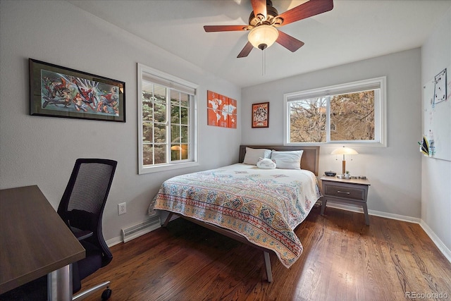 bedroom with multiple windows, ceiling fan, and dark wood-type flooring