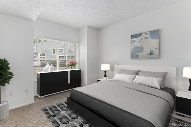 7453 Singing Hills Dr Unit E105, Boulder, CO 80301 - carpeted bedroom with a textured ceiling and baseboards