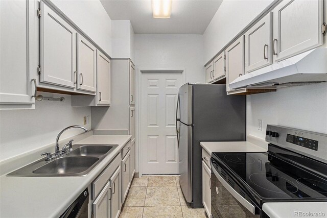 7453 Singing Hills Dr Unit E105, Boulder, CO 80301 - kitchen with stainless steel appliances, under cabinet range hood, a sink, and light countertops