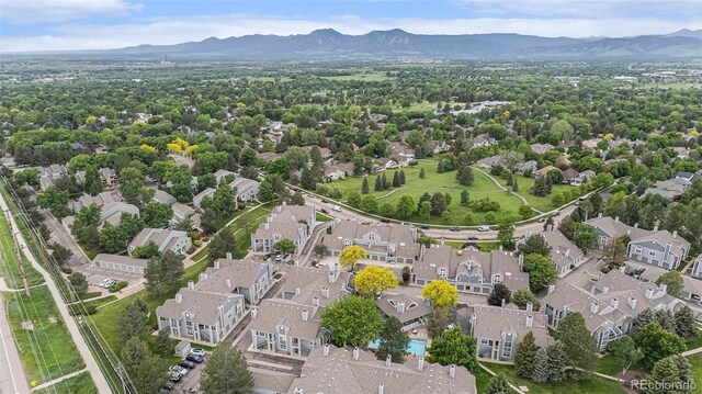 7453 Singing Hills Dr Unit E105, Boulder, CO 80301 - aerial perspective of suburban area featuring a mountain backdrop