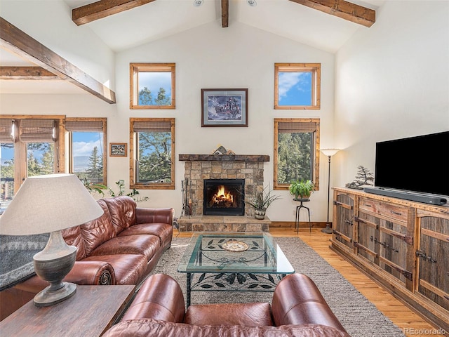 living room featuring beam ceiling, high vaulted ceiling, hardwood / wood-style flooring, and a fireplace