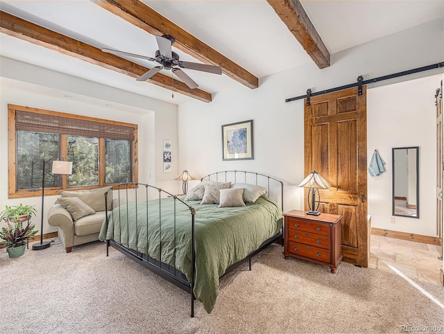 bedroom featuring carpet flooring, beam ceiling, a barn door, and ceiling fan