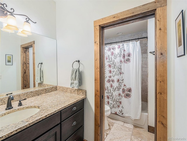 full bathroom with vanity with extensive cabinet space, toilet, tile floors, and shower / bath combo