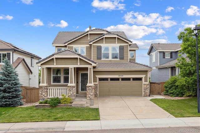 10535 Laurelglen Cir, Highlands Ranch, CO 80130 - craftsman-style home featuring stone siding, an attached garage, concrete driveway, and a tiled roof