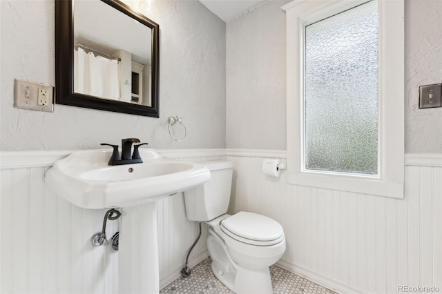 bathroom featuring tile patterned floors and toilet