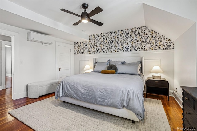 bedroom featuring dark hardwood / wood-style floors, an AC wall unit, and ceiling fan