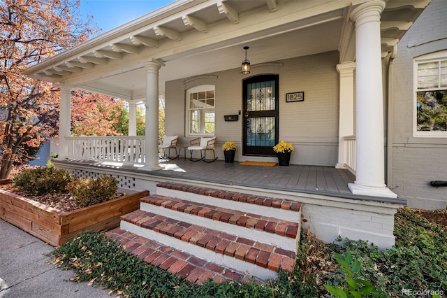 doorway to property with a porch