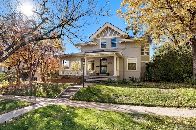 view of front of property with a front lawn and a porch