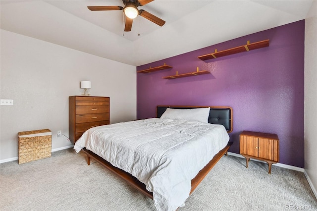 carpeted bedroom with visible vents, ceiling fan, and baseboards