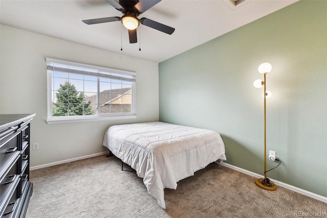 bedroom with baseboards, a ceiling fan, and light colored carpet