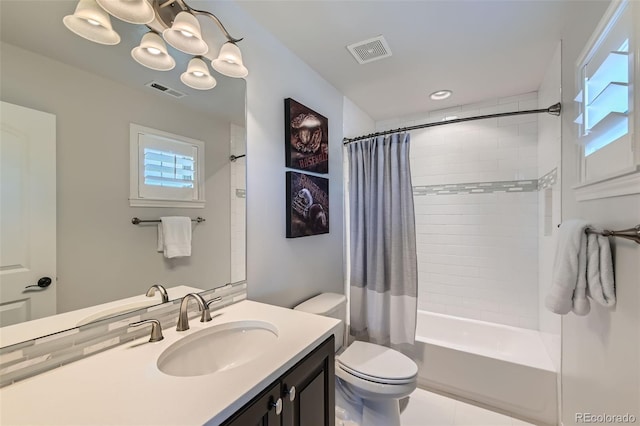 full bathroom featuring vanity, toilet, shower / tub combo, and a notable chandelier