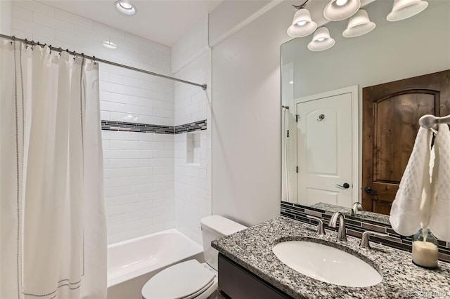 full bathroom with vanity, toilet, and shower / tub combo with curtain