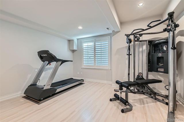 workout room with hardwood / wood-style floors