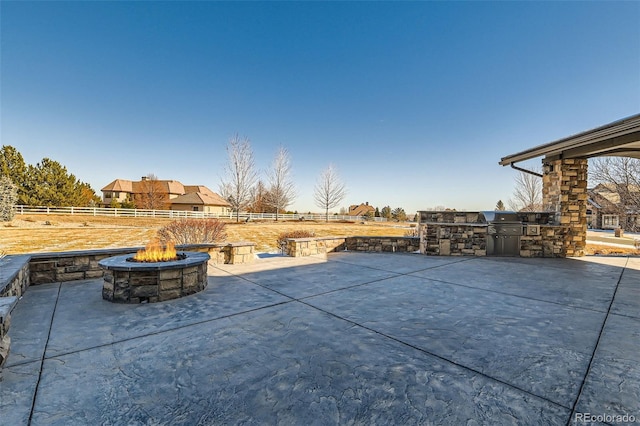 view of patio / terrace featuring area for grilling, an outdoor fire pit, and grilling area