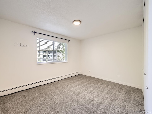 750 S Clinton St Unit 2C, Denver, CO 80247 - empty room with a baseboard radiator, carpet flooring, and baseboards