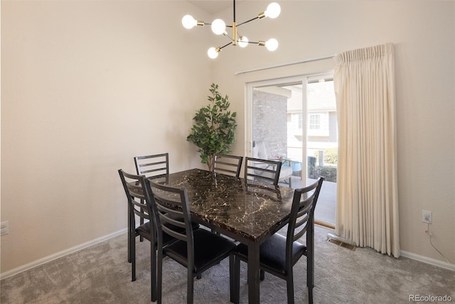 carpeted dining space with an inviting chandelier, baseboards, and visible vents