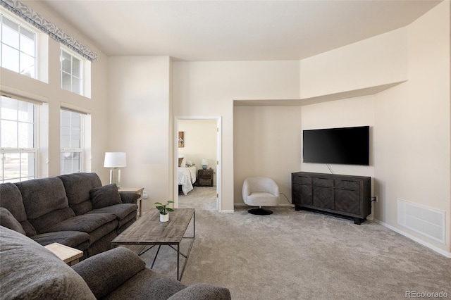 carpeted living room with visible vents