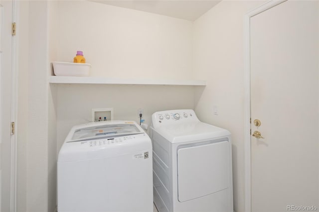 washroom with laundry area and washer and dryer