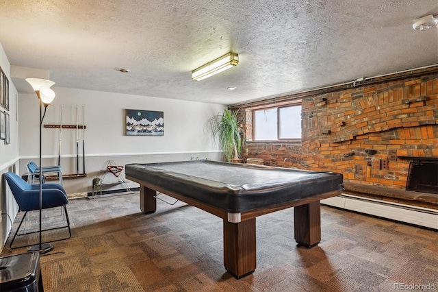game room with pool table, baseboard heating, a textured ceiling, and carpet floors