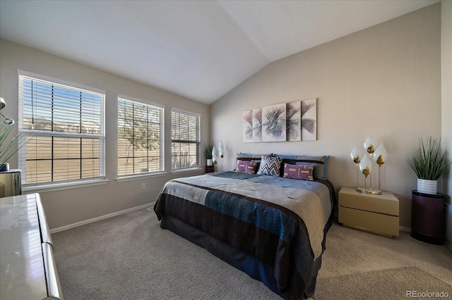 bedroom featuring carpet floors, lofted ceiling, and baseboards