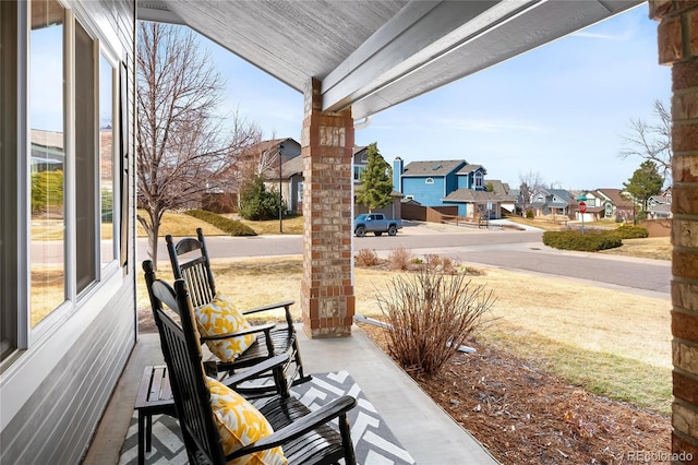 view of patio with a residential view and a porch