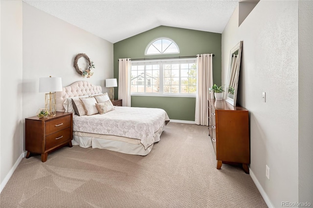 bedroom featuring baseboards, lofted ceiling, a textured ceiling, and light carpet