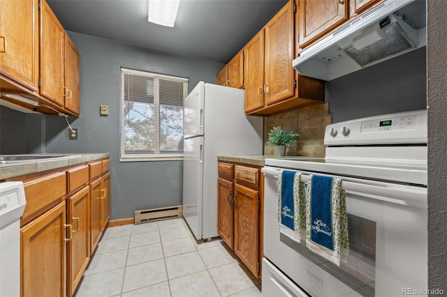 kitchen featuring light tile patterned floors, white appliances, a baseboard radiator, and backsplash