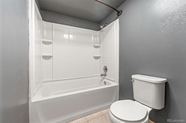 bathroom with tile patterned floors, toilet, and shower / tub combination