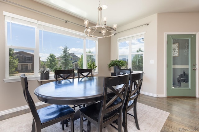 1849 Mud Hen Dr, Colorado Springs, CO 80921 - dining room with a chandelier and wood finished floors
