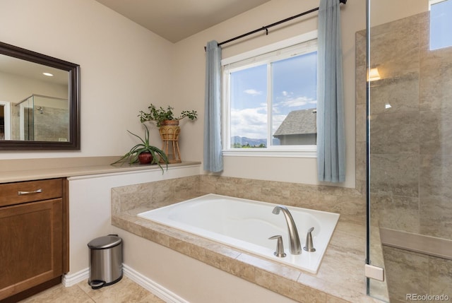 1849 Mud Hen Dr, Colorado Springs, CO 80921 - full bath with a bath, vanity, tiled shower, and tile patterned flooring