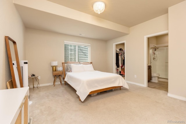 1849 Mud Hen Dr, Colorado Springs, CO 80921 - bedroom with light colored carpet, a spacious closet, ensuite bathroom, and a closet