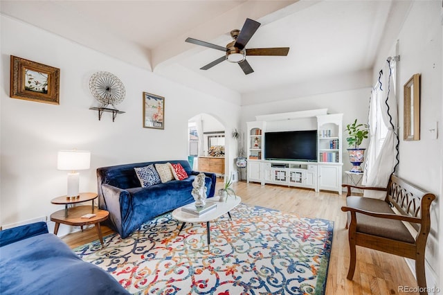 3106 N Franklin St, Denver, CO 80205 - living area featuring ceiling fan, beam ceiling, arched walkways, and wood finished floors