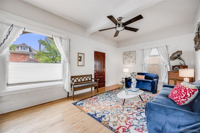 3106 N Franklin St, Denver, CO 80205 - living area featuring a ceiling fan, wood finished floors, and beamed ceiling