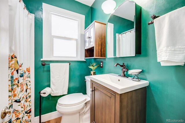 3106 N Franklin St, Denver, CO 80205 - full bath with vanity and a shower with shower curtain