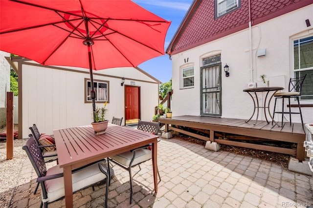 3106 N Franklin St, Denver, CO 80205 - view of patio / terrace with outdoor dining space and a deck
