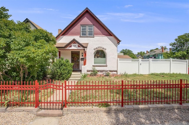 3106 N Franklin St, Denver, CO 80205 - victorian house featuring stucco siding and a fenced front yard