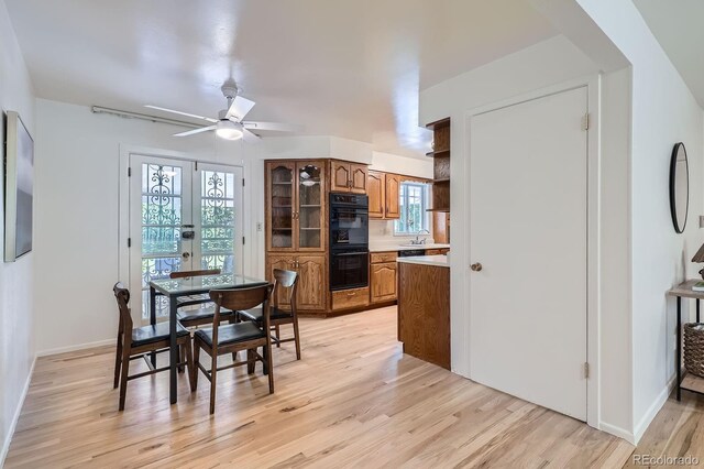 366 Kenton St, Aurora, CO 80010 - dining space with light wood-style floors and ceiling fan