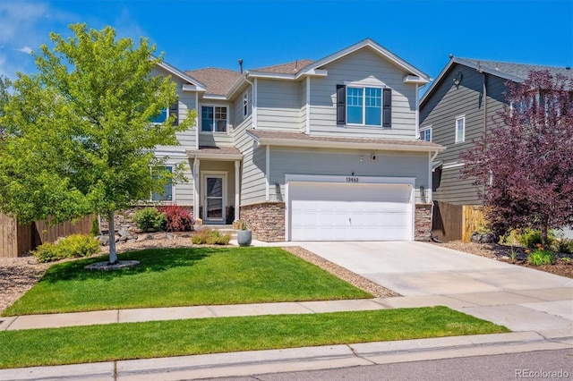 13463 Tamarac Pl, Thornton, CO 80602 - traditional-style house with stone siding, an attached garage, driveway, and roof with shingles