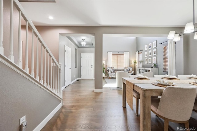 13463 Tamarac Pl, Thornton, CO 80602 - dining room featuring wood finished floors and stairway