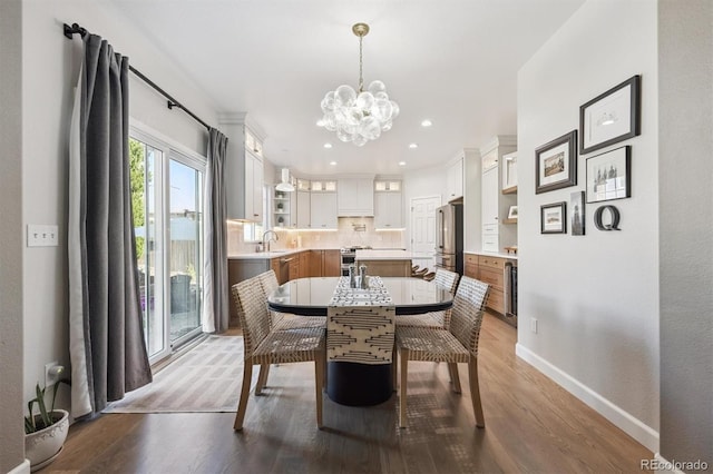 13463 Tamarac Pl, Thornton, CO 80602 - dining space featuring a chandelier, light wood-style floors, and recessed lighting