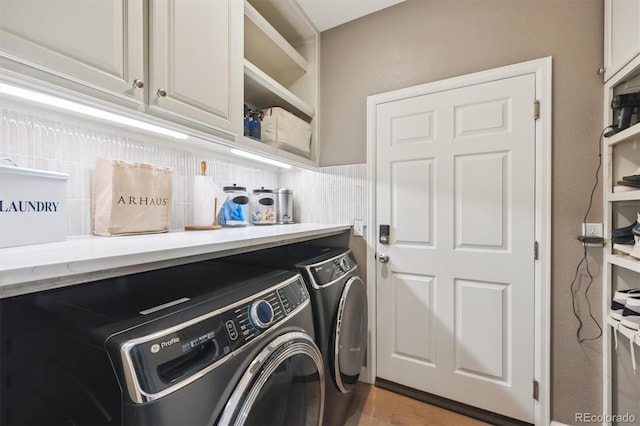 13463 Tamarac Pl, Thornton, CO 80602 - laundry room with cabinet space and washer and clothes dryer