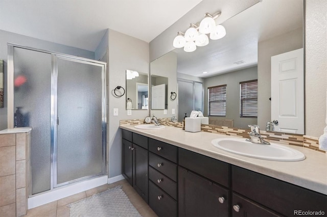 13463 Tamarac Pl, Thornton, CO 80602 - full bathroom featuring double vanity, a shower stall, and tile patterned floors