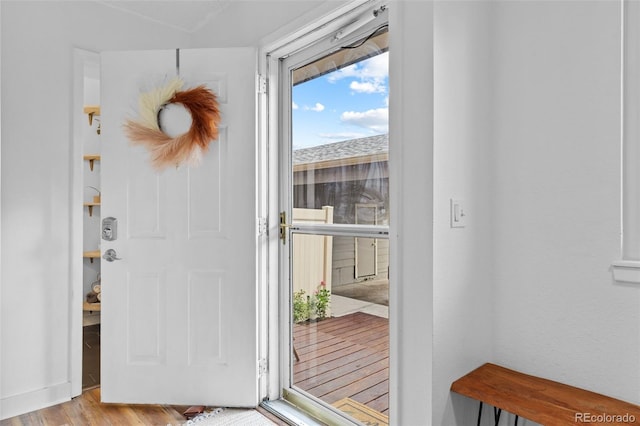 doorway featuring wood finished floors
