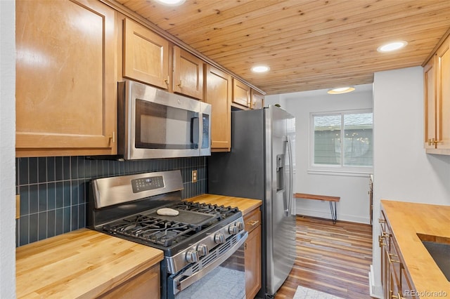kitchen with recessed lighting, appliances with stainless steel finishes, wooden ceiling, and butcher block counters